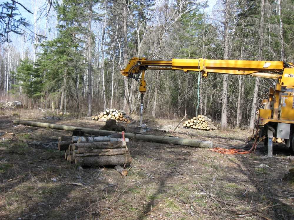 Naturist Legacy History: Gallery 08/03...Hydro installs power line poles