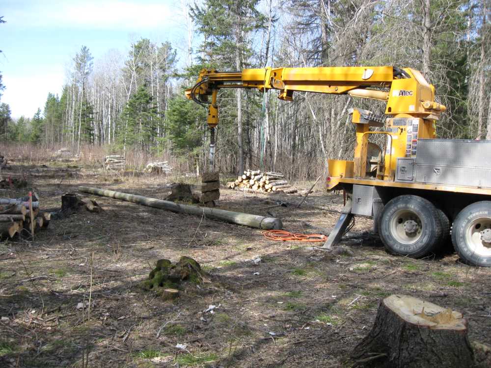 Naturist Legacy History: Gallery 08/07...Hydro installs power line poles