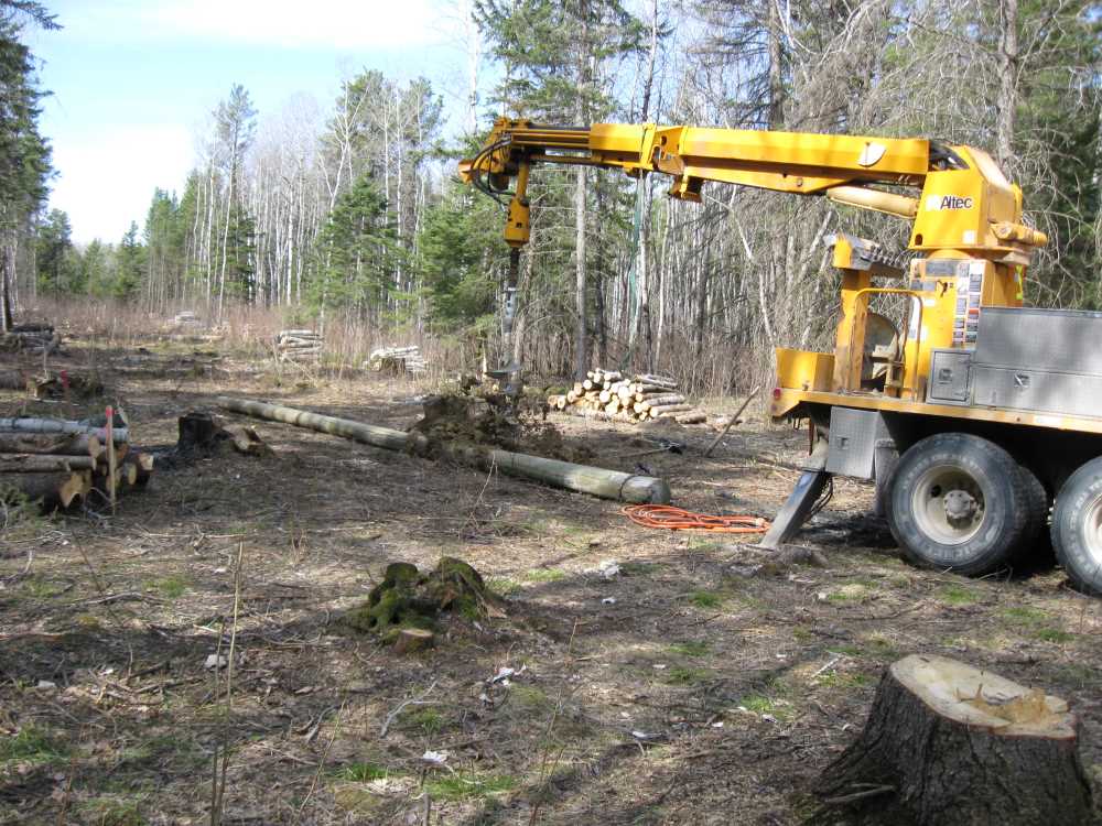 Naturist Legacy History: Gallery 08/08...Hydro installs power line poles