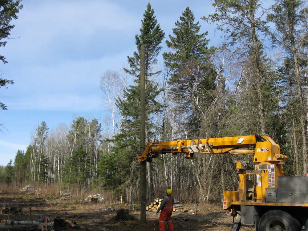 Naturist Legacy History: Gallery 08/11...Hydro installs power line poles