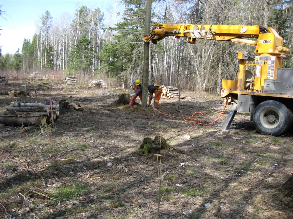 Naturist Legacy History: Gallery 08/12...Hydro installs power line poles