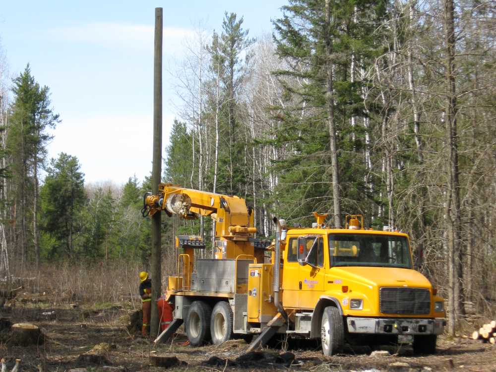 Naturist Legacy History: Gallery 08/14...Hydro installs power line poles