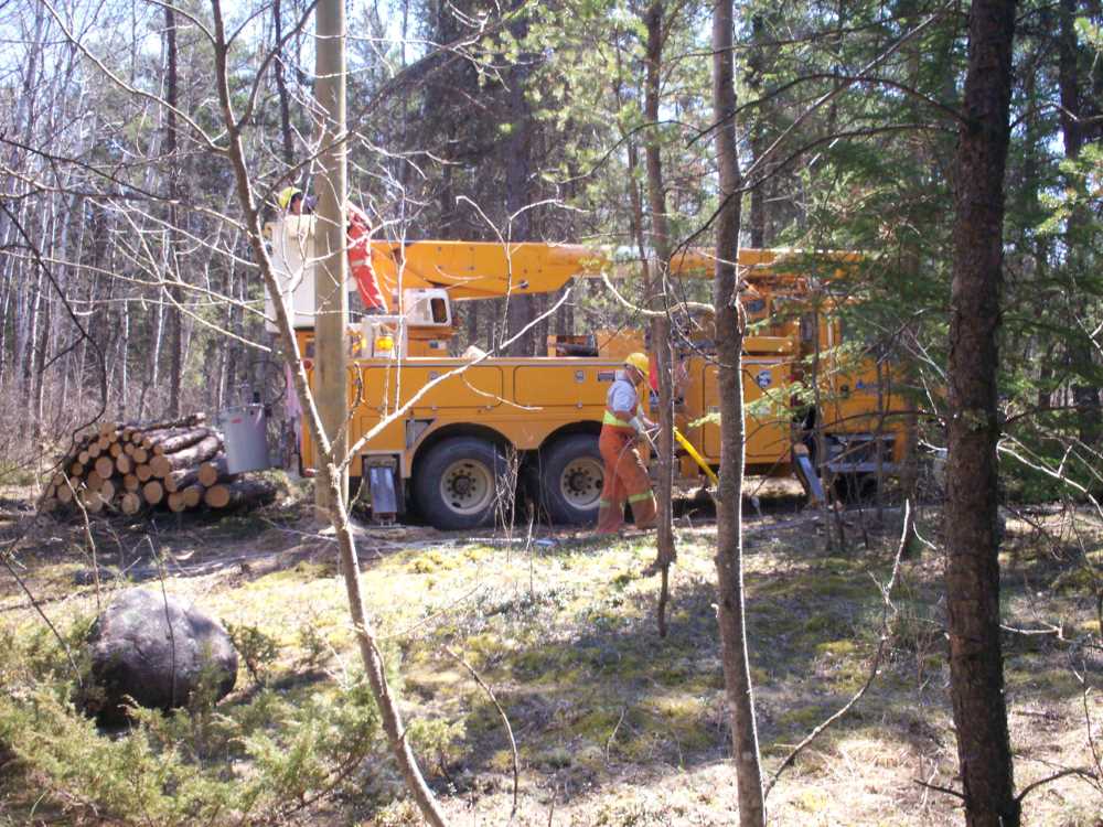 Naturist Legacy History: Gallery 09/10...Hydro installs wires and a transformer