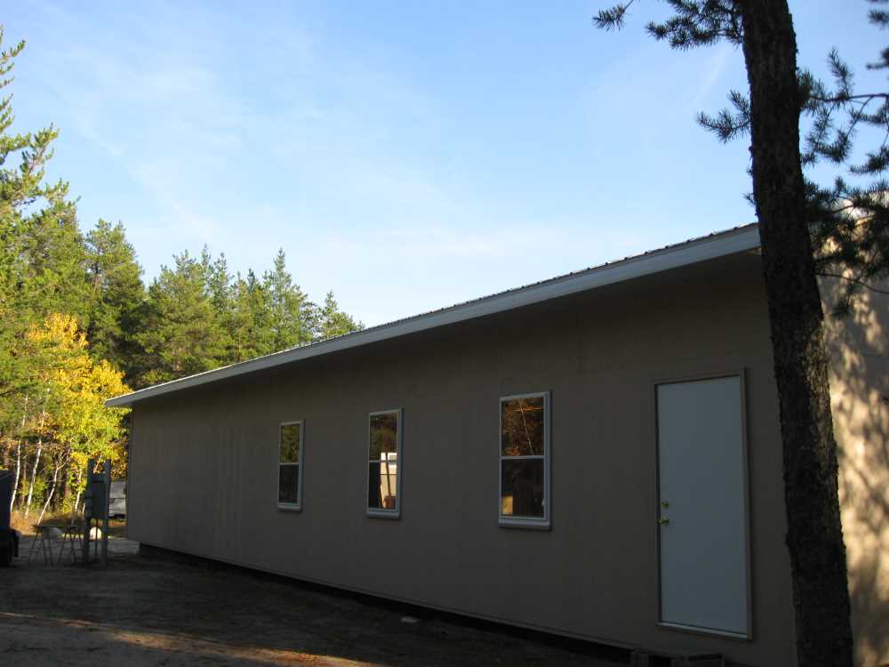 Naturist Legacy History: Gallery 44/13...Doors, windows, soffit installed